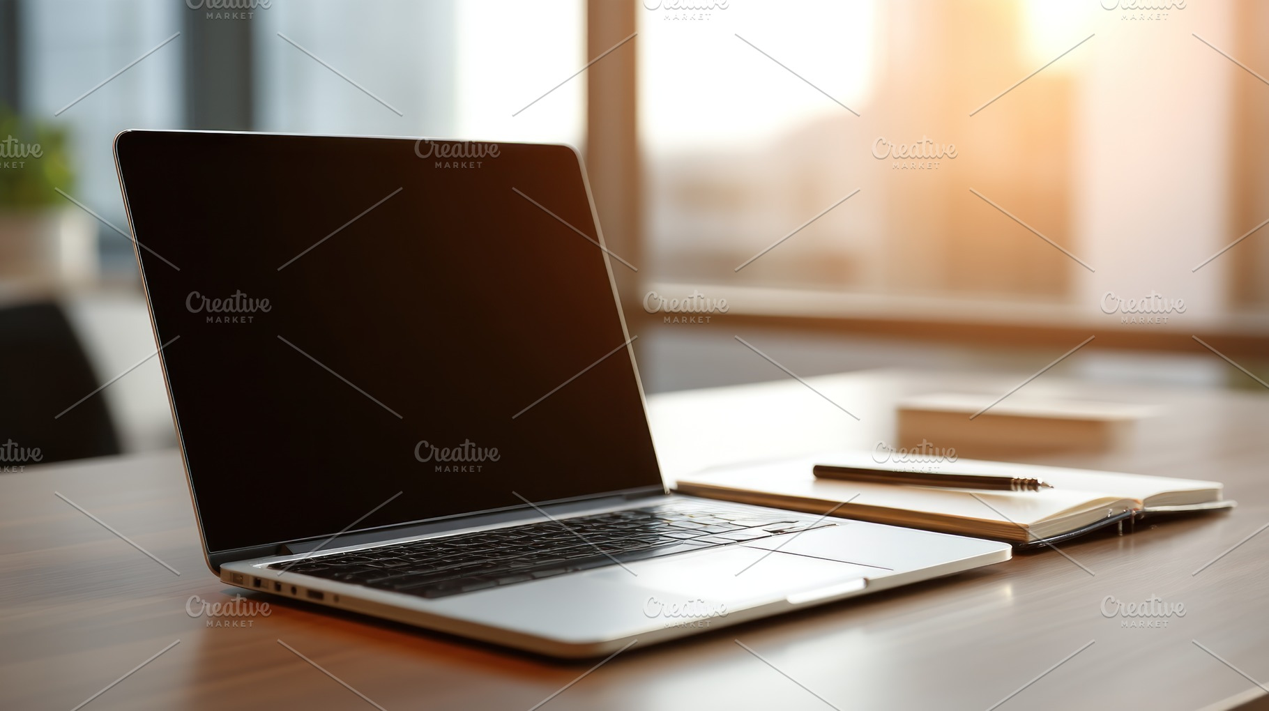 Laptop with black screen on modern wooden desk next to notebook, an Abstract Photo by José Manuel Gelpi