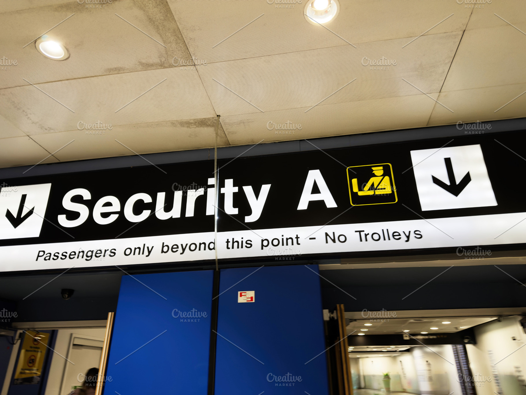 Security A checkpoint sign at Manchester Airport terminal directing passengers, a Photo by AS photostudio