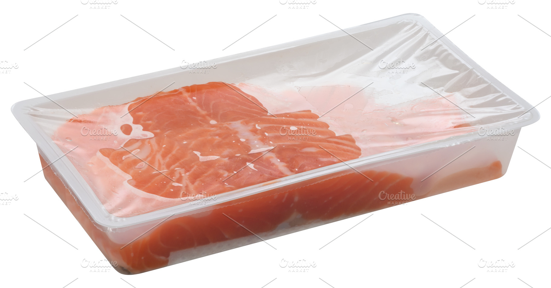 Slices of raw salmon fillets are packaged in a clear plastic tra, a Food & Drink Photo by ndanko