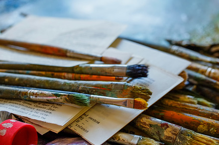 Paintbrushes and paints stock photo containing art and artist