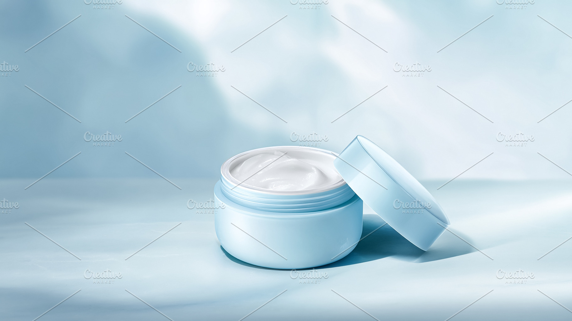 Hydrating facial cream in open pale blue cosmetic jar with lid c, a Photo by Studio ANNA