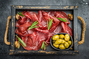 Italian bresaola with rosemary and green olives served in a vint, a Food & Drink Photo by composter-box@mail.ru