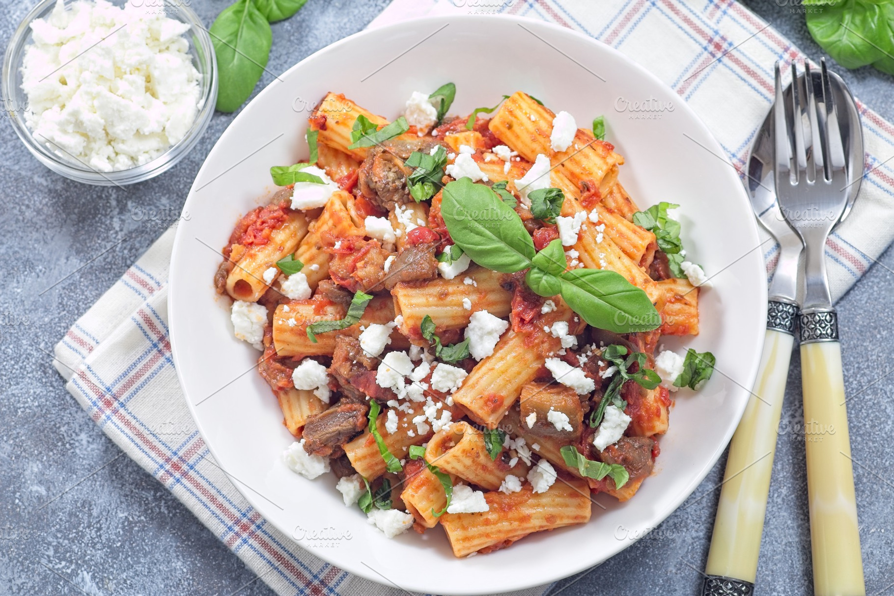 Rigatoni alla Norma pasta with eggplant, tomato, basil and ricotta salata, hori, a Food & Drink Photo by iuliia_n