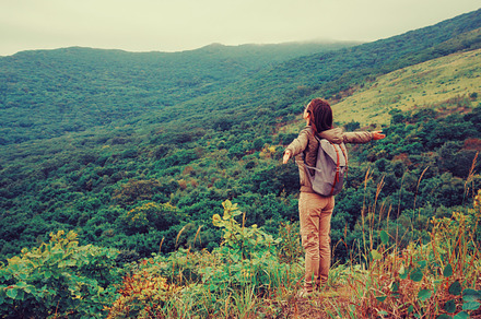 Happy traveler woman standing