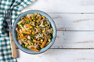 Pasta salad with tuna, corn and olives in bowl, a Food & Drink Photo by etorres69
