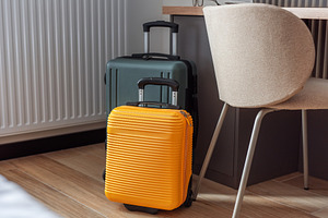 Travel suitcases standing in modern hotel room, waiting for jour, a Holiday Photo by Olena Rudo