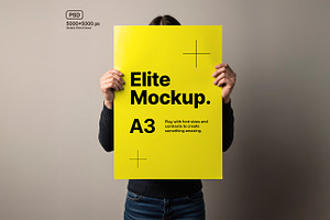 Woman Holding A3 Poster, an Advertising Mockup by Elite Mockups