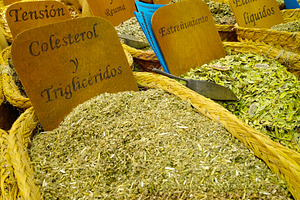 Medicinal herbs on display at health product stand, a Food & Drink Photo by DanFLCreativo