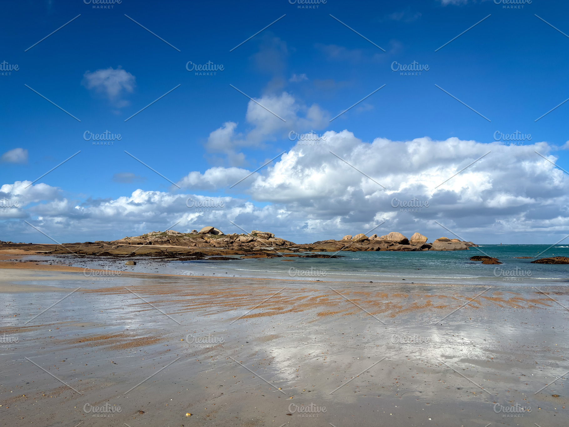 Granite reefs and shallow water along Tregastel Brittany France, a Nature Photo by GoodGoods