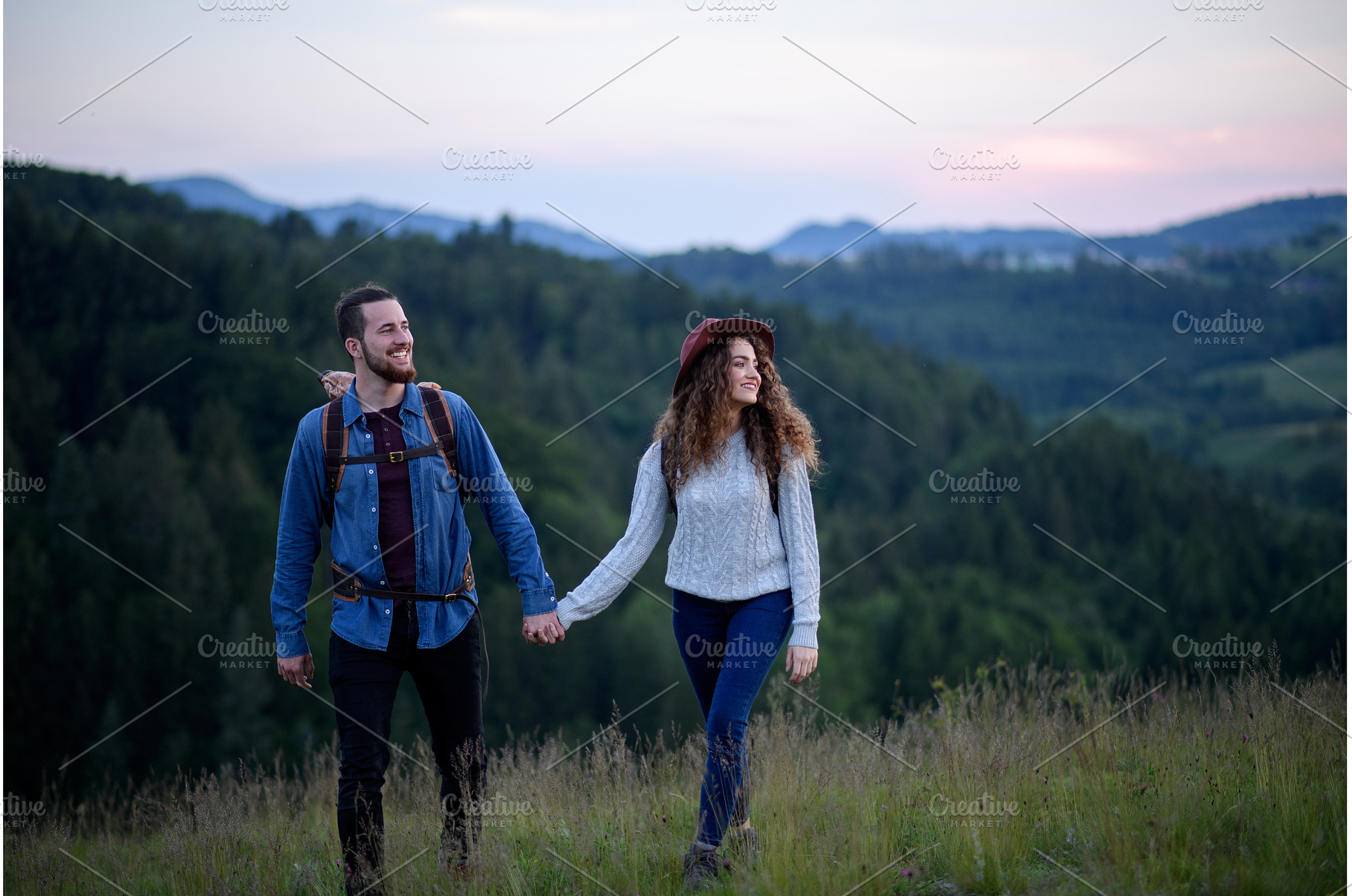 Travellers couple hiking on trail in, a Person Photo by HalfPoint