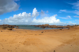 Rocky tidal island under bright skies in Tregastel, Brittany, Fr, a Nature Photo by GoodGoods