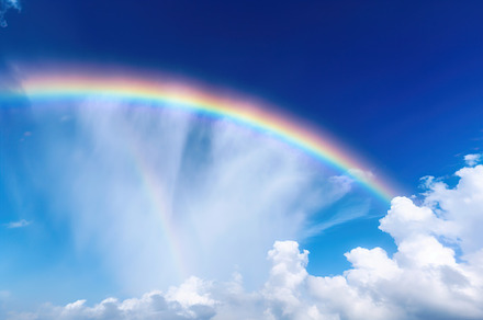 Beautiful sky with colorful rainbow and white clouds. Generative AI, a Nature Photo by AlyaAnd