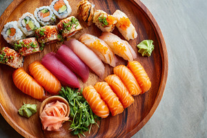 Assorted sushi platter with nigiri and rolls, a Food & Drink Photo by AlyaAnd