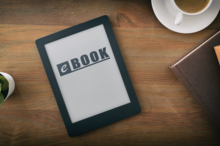 Reading concept at home with ebook on wooden table, a Technology Photo by Davizro's Market