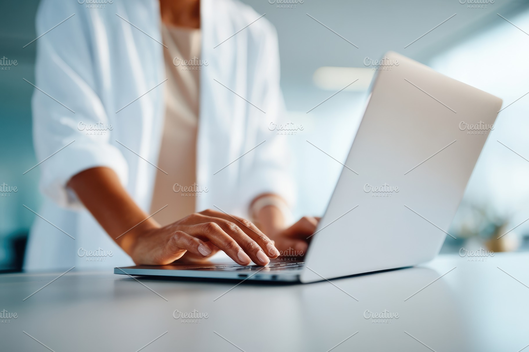 Woman working on laptop in modern office, a Business Photo by AlyaAnd