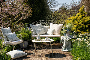Elegant patio furniture styling a peaceful garden setting with b, a Photo by Studio ANNA