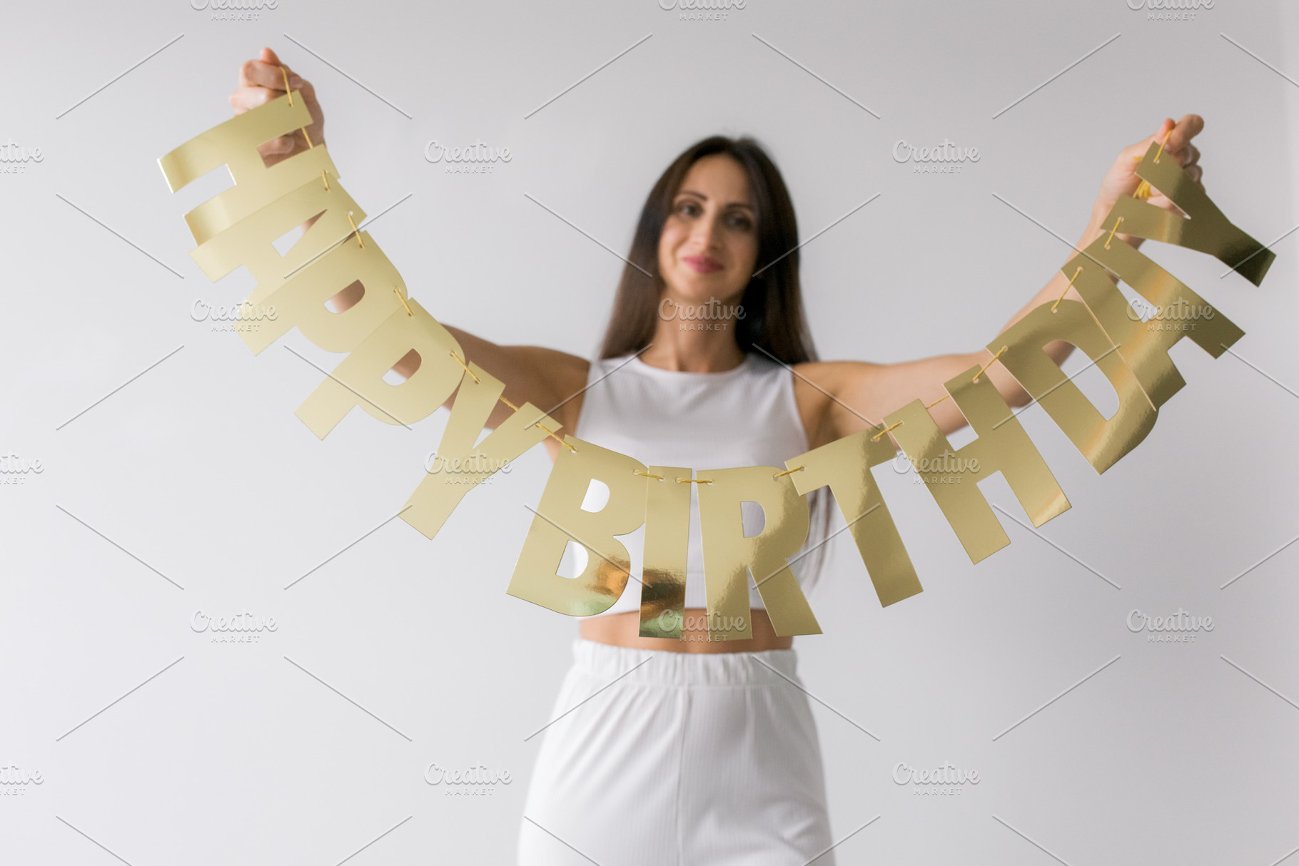 A woman with Happy birthday sign, a Holiday Photo by Kolomiyets Viktoriya
