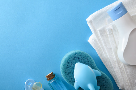 Baby bath accessories isolated on blue table, a Health & Medical Photo by Davizro's Market