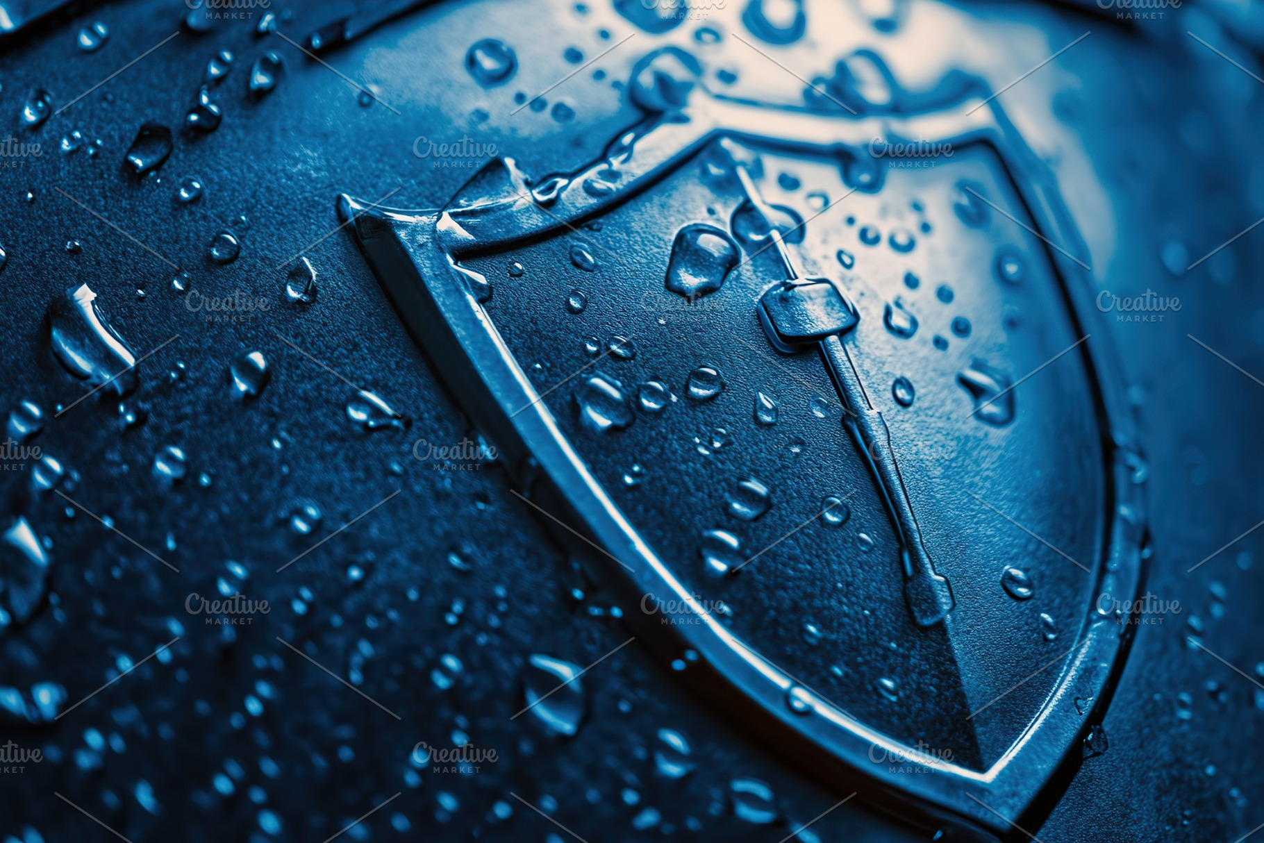 Blue security shield with water droplets highlighting its protective features a, a Business Photo by AlyaAnd