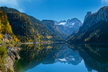 Peaceful autumn Alps mountain lake with clear transparent water, a Nature Photo by YuriyB