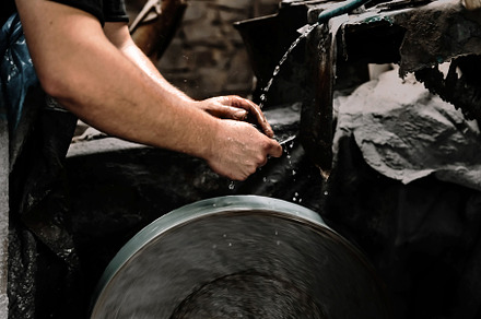 Wet tool sharpening on a polishing w, an Industrial Photo by Perpis