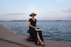 Fashionable woman sits on mooring po, a Beauty & Fashion Photo by Elena Vagengeim