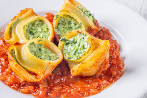 Plated lumaconi stuffed with ricotta, a Food & Drink Photo by Alexander Prokopenko