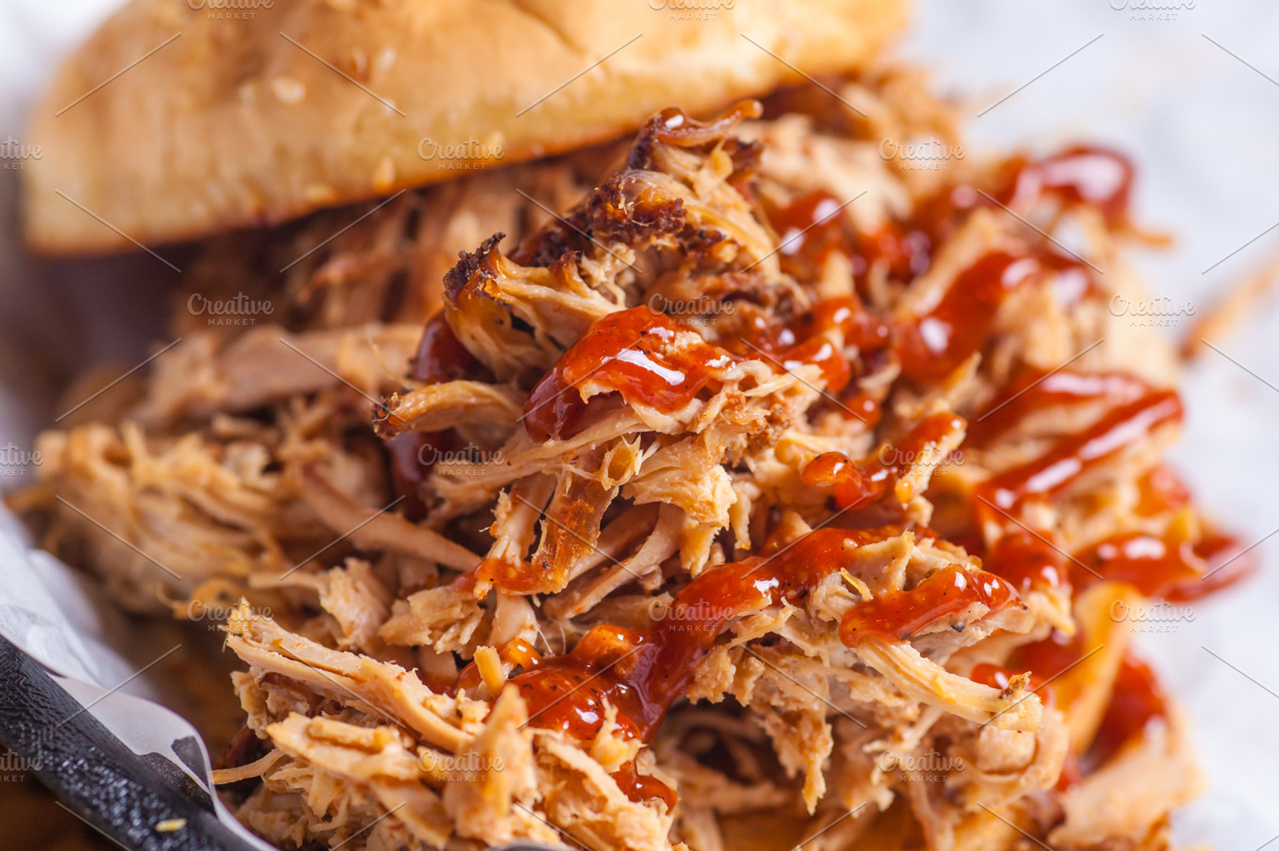 Pulled pork sandwich close up featuring appetite, barbeque, and bread, a Food & Drink Photo by Hidden Hallow