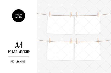 A4 prints mockup with clothespins