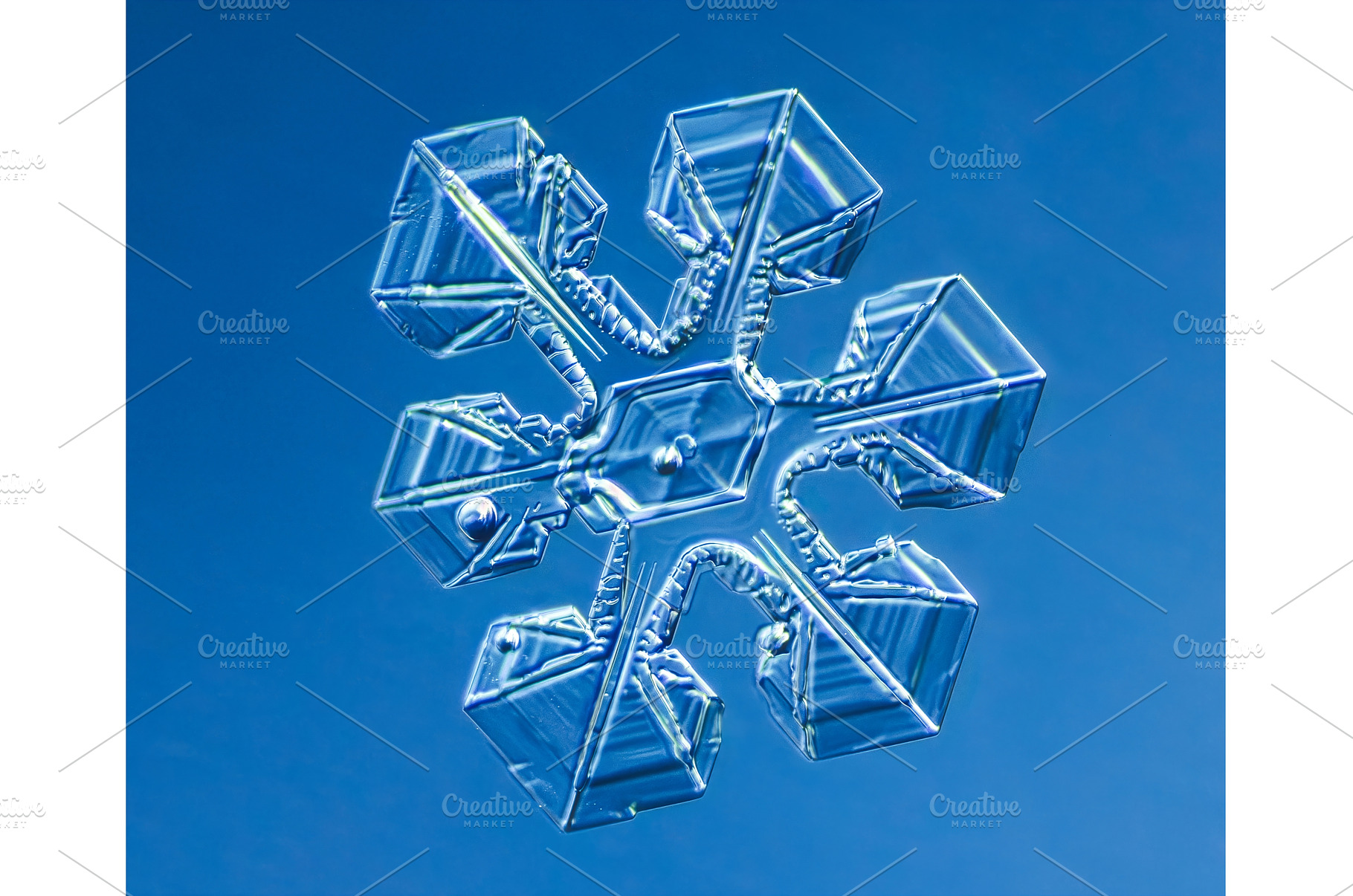 Natural snowflake crystal in blue, a Nature Photo by Lukas Jonaitis SHOP