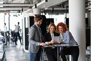 Group of coworkers discussing, a Business Photo by HalfPoint