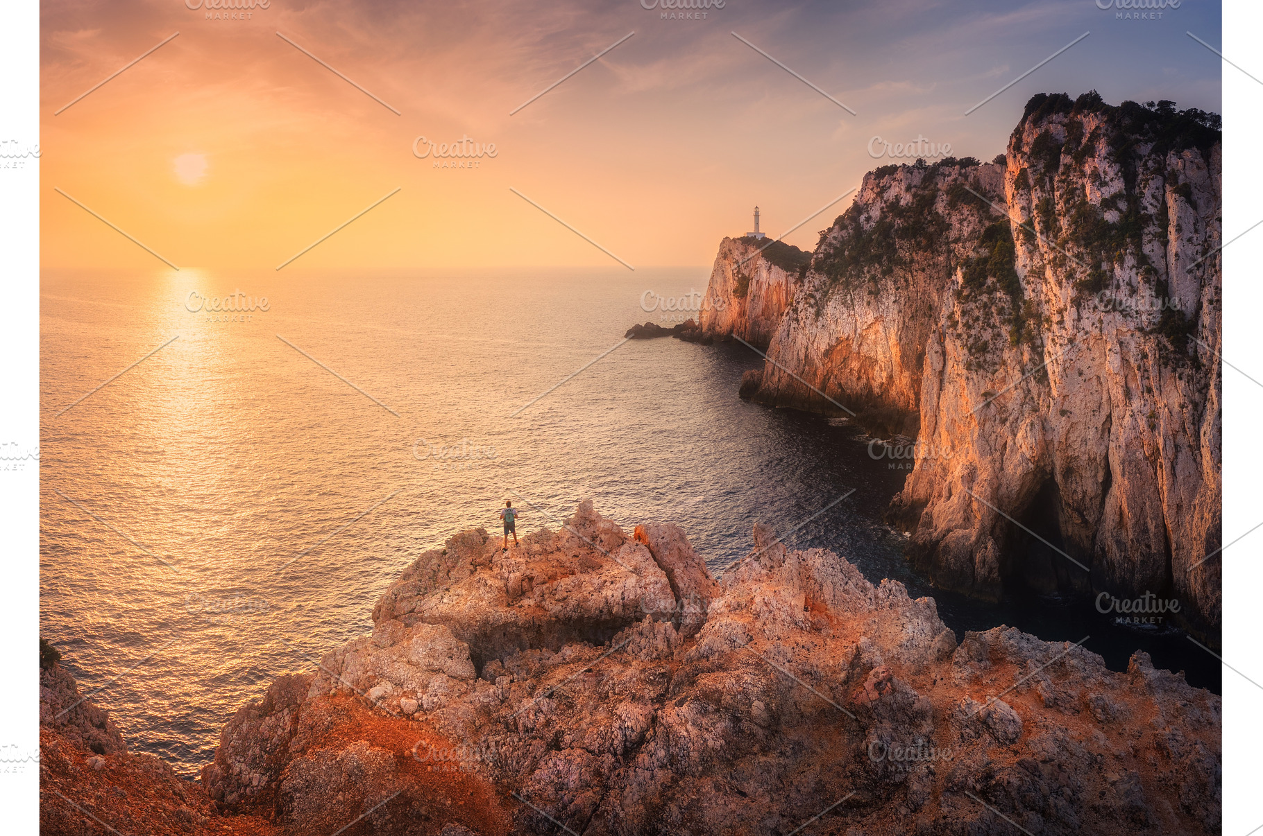 Aerial view of man on mountain peak, a Nature Photo by den-belitsky