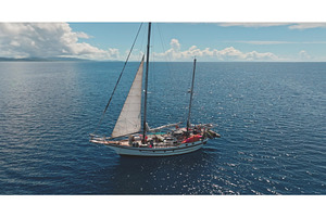 Ketch sailing in the ocean near a, a Transportation Photo by Goinyk