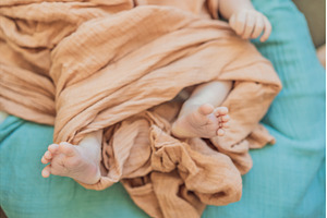 Newborn baby comfortably resting in, a Health & Medical Photo by Elizaveta Galitskaya