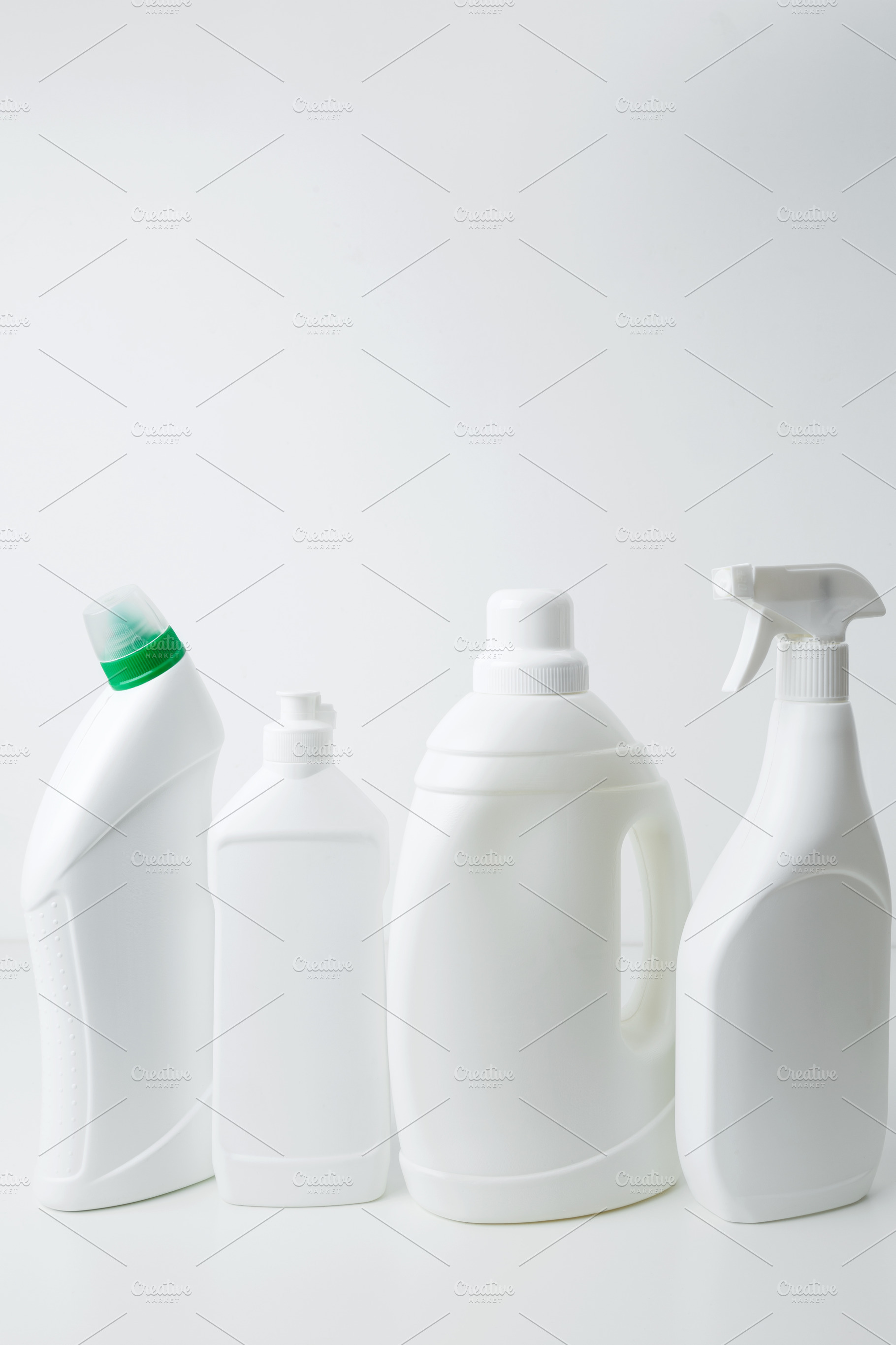 Various cleaning supplies branding mockup, symbolizing spring cleaning. Househo, a Photo by matucha