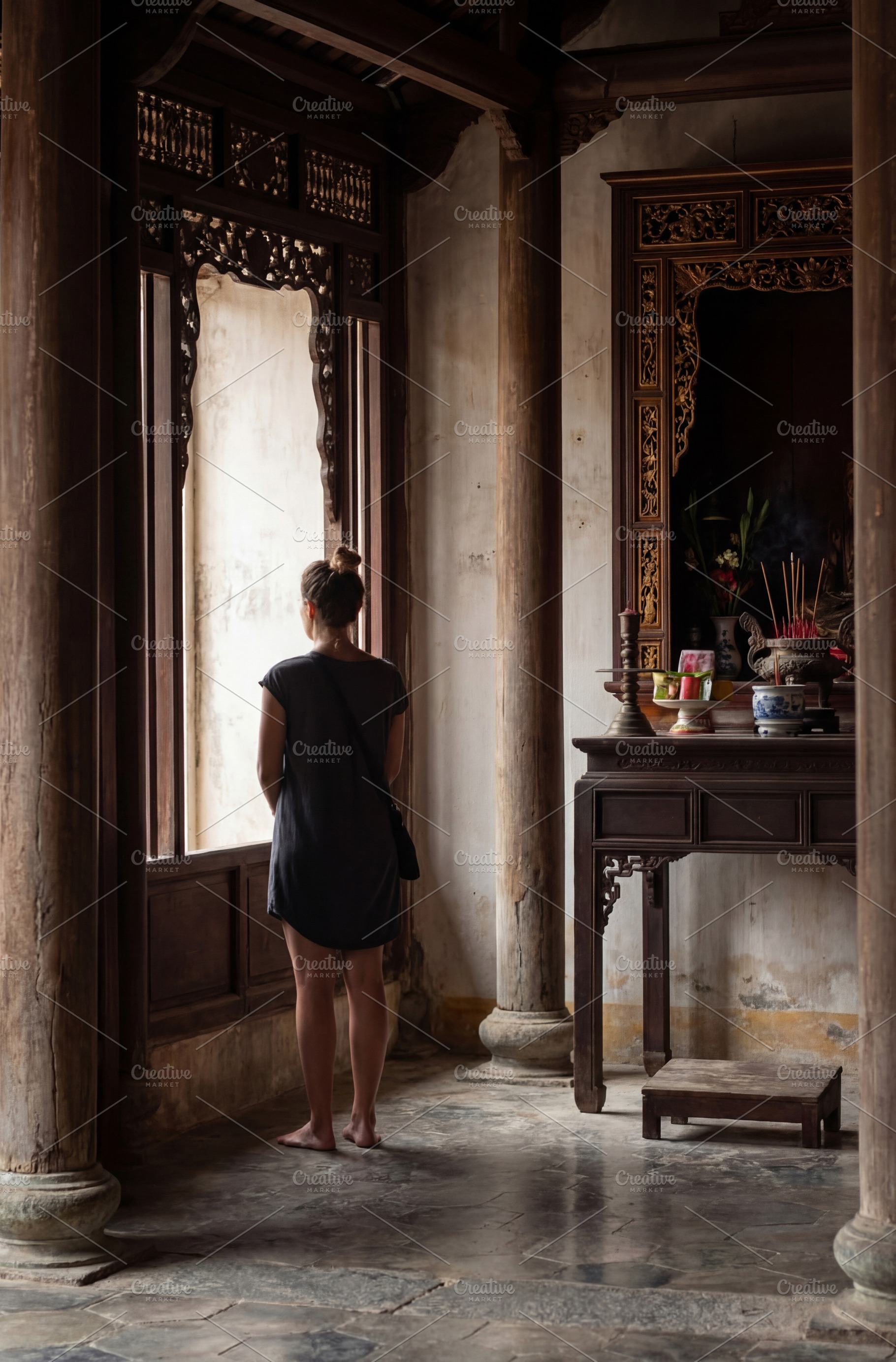 Woman Looking Out Temple Window, a Person Photo by Virgo Studio