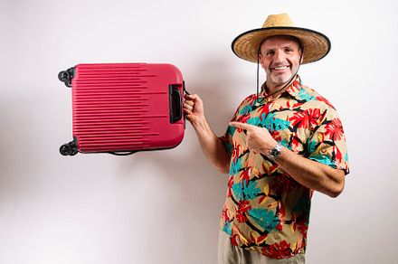 Man ready for vacation with red suitcase
