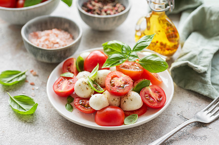 Caprese salad with tomatoes, mozzarella and basil., a Food & Drink Photo by Olena Rudo