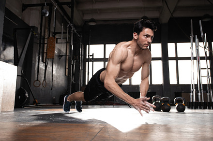 muscular man doing a pushups at gym, a Sports & Recreation Photo by OPOLJA
