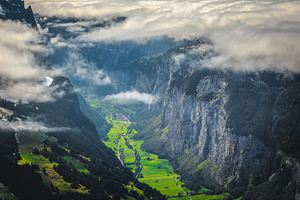Green fields and stunning cliffs, a Nature Photo by Alpine Dreams