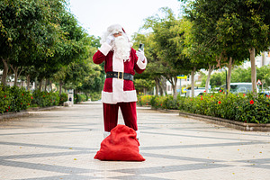 Lost Santa Claus checking smartphone for directions, a Photo by etorres69