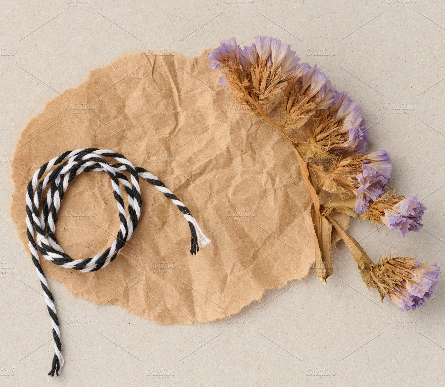 A composition of dried flower sprigs and black and white lace on, a Background Photo by ndanko