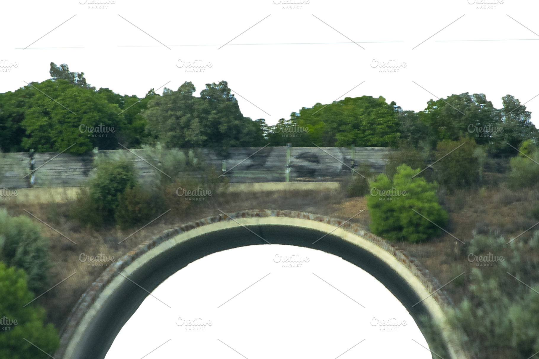 Arched roadway crossing rural, a Background Photo by DanFLCreativo