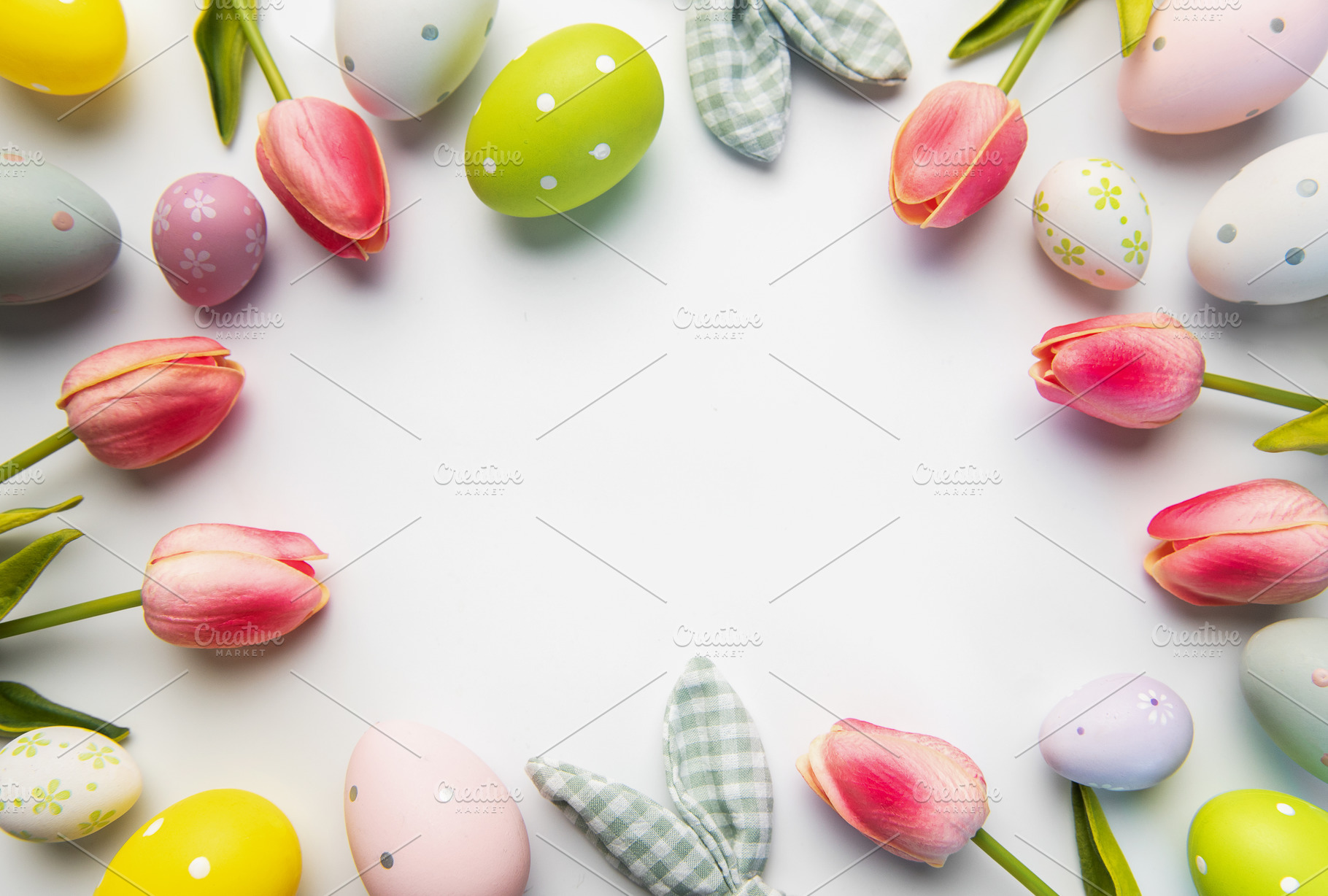 Easter eggs and tulips forming a festive frame, a Holiday Photo by Olena Rudo