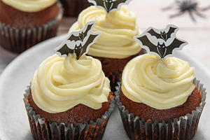 Halloween cupcakes with bat toppers and autumn leaves, a Food & Drink Photo by Olena Rudo