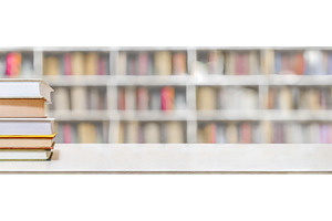 A stack of books on a white table, a School & Education Photo by Igor Tichonow
