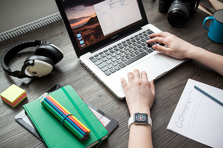 Woman photographer working on laptop, a Business Photo by Jakub Kostal