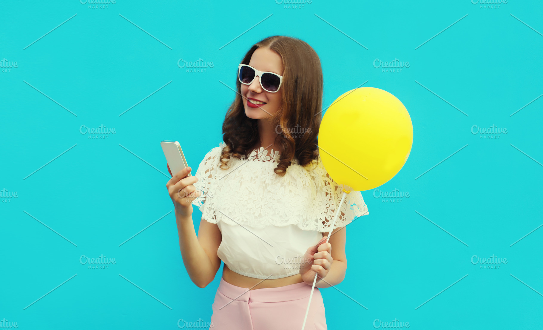 woman with phone holding balloon, a Person Photo by Rohappy