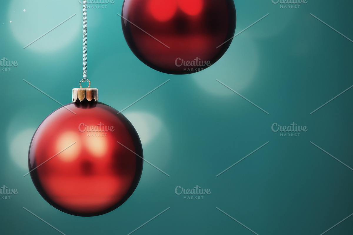 Christmas red and green matte ornaments on teal green background, a Photo by Dvoevnore photos (Photo 1 of 2)
