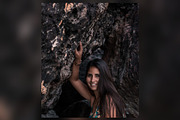Smiling Woman in a Rock Cave, a Beauty & Fashion Photo by Chris Joel Campbell (Thumbnail 1 of 2)